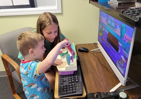 children play on computer