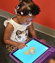 boy and girl play on iPad