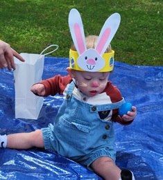 boy hunts for Easter eggs