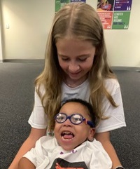 Lekotek leader and child play